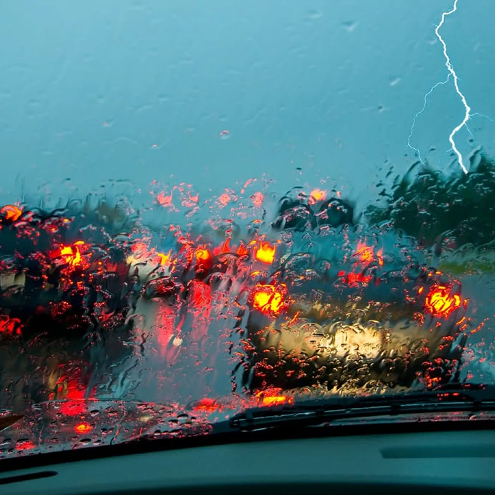 rainy road with lightning storm